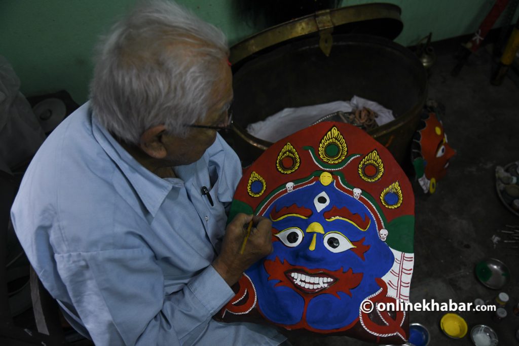 The 83-year-old Tej Bahadur Chitrakar working on Aakash Bhairav’s mask. Photo: Chandra Bahadur Ale